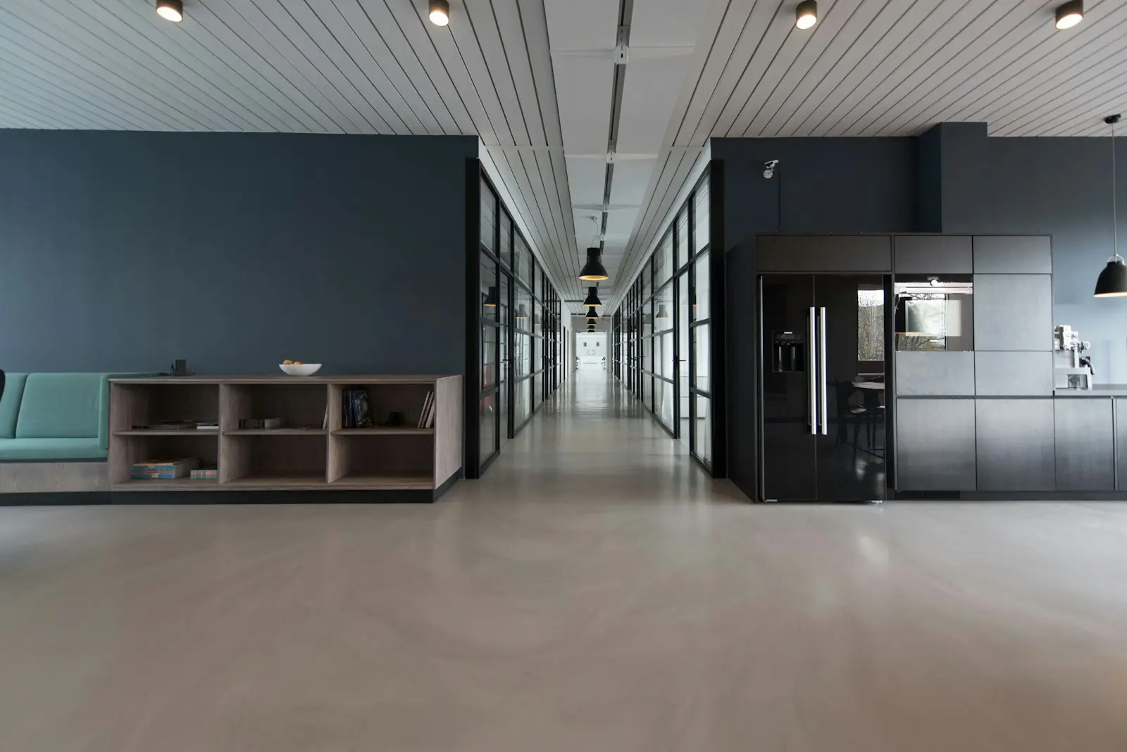 A modern office corridor with glass walls